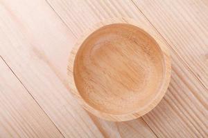 Empty wood bowl on wooden background