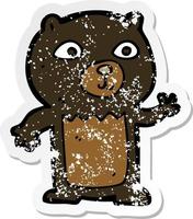 retro distressed sticker of a cartoon waving black bear cub vector