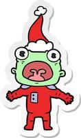 sticker cartoon of a weird alien communicating wearing santa hat vector