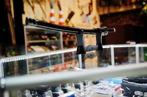 Samurai sword on shelves store weapons on shop center. photo