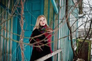 Blonde girl with hand embroidered scarf posed at winter day. Women's handkerchief. photo