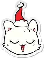 sticker cartoon of a cat face wearing santa hat vector