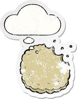 cartoon biscuit and thought bubble as a distressed worn sticker vector