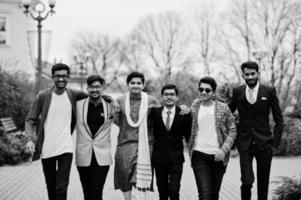Group of six south asian indian mans in traditional, casual and business wear walking. photo