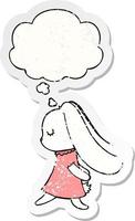 cute cartoon rabbit and thought bubble as a distressed worn sticker vector