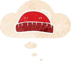 cartoon woolly hat and thought bubble in retro textured style vector