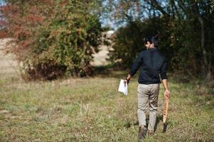 South asian agronomist farmer inspecting his farm. Agriculture production concept. photo