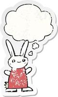 cute cartoon rabbit and thought bubble as a distressed worn sticker vector