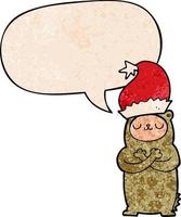 cartoon bear wearing christmas hat and speech bubble in retro texture style vector