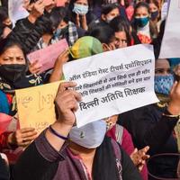 New Delhi, India December 25 2021 - Delhi Contractual Guest Teachers with posters, flags and graffitis protesting against Delhi AAP Government for making policy, Delhi Guest Teachers protesting photo