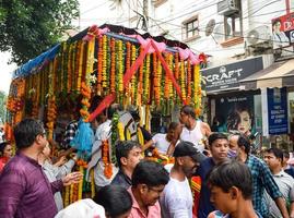New Delhi, India July 01 2022 - A huge gathering of devotees from different parts of Delhi on the occasion of ratha yatra or rathyatra. Rath for Lord Jagannath pulled by people, Jagannath Rath Yatra photo
