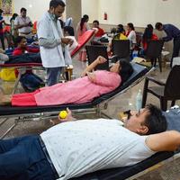 Delhi, India, June 19 2022 - Blood donor at Blood donation camp held at Balaji Temple, Vivek Vihar, Delhi, India, Image for World blood donor day on June 14 every year, Blood Donation Camp at Temple photo