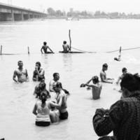 Garh Mukteshwar, UP, India, June 11 2022 -People are taking holy dip on the occasion of Nirjala Ekadashi, A view of Garh Ganga Brij ghat which is very famous religious place for Hindus-Black and White photo