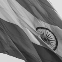 India flag flying at Connaught Place with pride in blue sky, India flag fluttering, Indian Flag on Independence Day and Republic Day of India, waving Indian flag, Flying India flags - Black and White photo