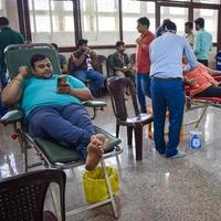 Delhi, India, June 19 2022 - Blood donor at Blood donation camp held at Balaji Temple, Vivek Vihar, Delhi, India, Image for World blood donor day on June 14 every year, Blood Donation Camp at Temple photo