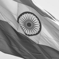 India flag flying at Connaught Place with pride in blue sky, India flag fluttering, Indian Flag on Independence Day and Republic Day of India, waving Indian flag, Flying India flags - Black and White photo