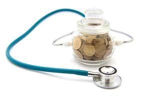 stethoscope with coins in the savings, financial concept photo