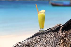 fruit cocktail on a tropical island beach photo