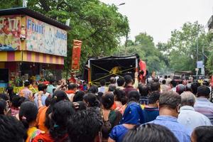 New Delhi, India July 01 2022 - A huge gathering of devotees from different parts of Delhi on the occasion of ratha yatra or rathyatra. Rath for Lord Jagannath pulled by people, Jagannath Rath Yatra photo
