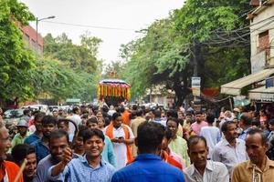 New Delhi, India July 01 2022 - A huge gathering of devotees from different parts of Delhi on the occasion of ratha yatra or rathyatra. Rath for Lord Jagannath pulled by people, Jagannath Rath Yatra photo