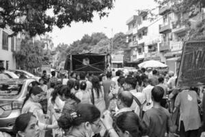 New Delhi, India July 01 2022 - A huge gathering of devotees from different parts of Delhi on the occasion of ratha yatra or rathyatra. Rath for Lord Jagannath pulled by people, Jagannath Rath Yatra photo