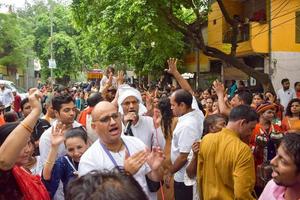 New Delhi, India July 01 2022 - A huge gathering of devotees from different parts of Delhi on the occasion of ratha yatra or rathyatra. Rath for Lord Jagannath pulled by people, Jagannath Rath Yatra photo