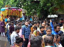 New Delhi, India July 01 2022 - A huge gathering of devotees from different parts of Delhi on the occasion of ratha yatra or rathyatra. Rath for Lord Jagannath pulled by people, Jagannath Rath Yatra photo