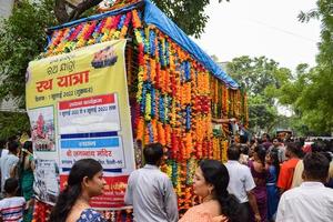 New Delhi, India July 01 2022 - A huge gathering of devotees from different parts of Delhi on the occasion of ratha yatra or rathyatra. Rath for Lord Jagannath pulled by people, Jagannath Rath Yatra photo