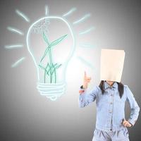 Businesswoman drawing and idea lamp photo