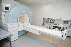 Magnetic resonance imaging scan or MRI machine device in hospital. photo