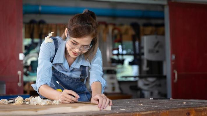 professional carpenter man working with woodwork industry tool