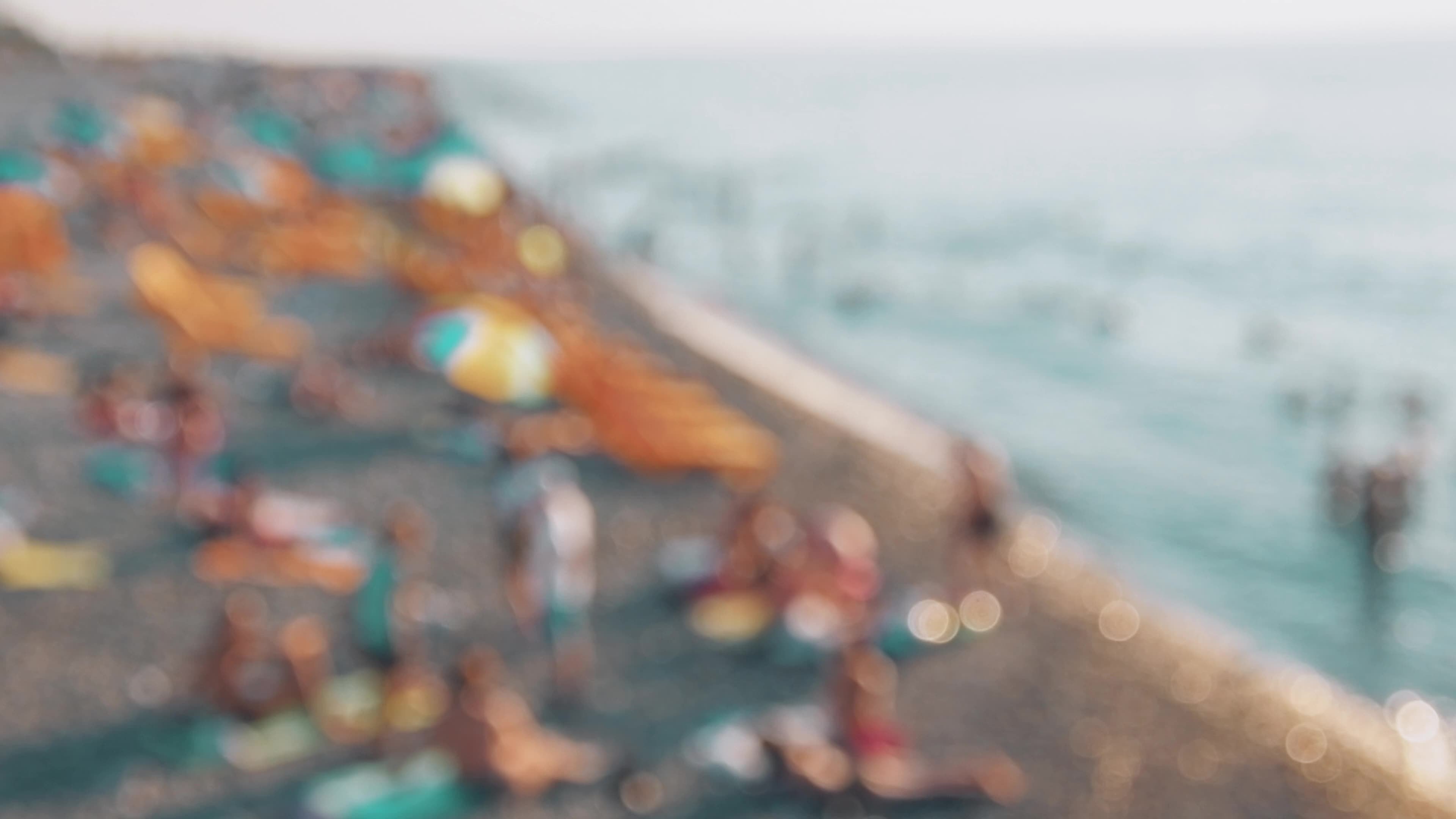 Zoom in copy space blurry background tourist on crowded summer beach by sea  relax. Intentional blur effect filter 10449791 Stock Video at Vecteezy