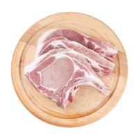 Raw pork chop on wooden broad or cooking pork chop steak photo