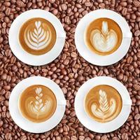 Latte art coffee on roasted coffee beans background photo