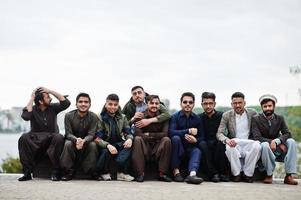 Group of pakistani man wearing traditional clothes salwar kameez or kurta. photo