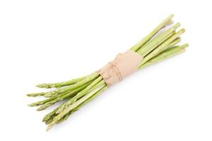 uncooked green asparagus tied with twine from above isolated on white background photo