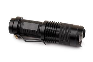 black metallic flashlight isolate on white background photo