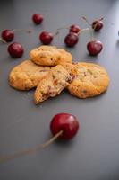 Delicious desert Cookie with cherry photo