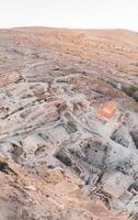 Panoramic view to Uplistsiche cave town caves with basilica in the middle and scenic rocky landscape. Blank space travel background. photo