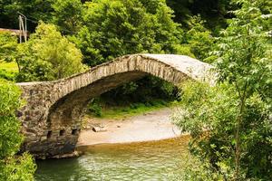 The stone arch bridge over the Ajaristskali river, Dandalo bridge, Georgia photo