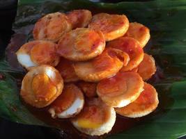 Balado eggs with banana leaf base. Indonesian special food. Indonesian traditional food photo
