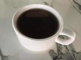 cup of hot tea on a marble table photo