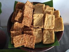 Fried tofu and tempeh on a banana leaf base. Indonesian special food. Indonesian traditional food photo