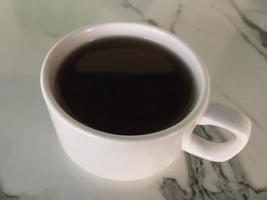 cup of hot tea on a marble table photo
