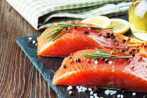 Raw salmon fillet with spices photo