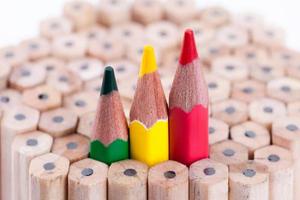 three sharpened green,yellow,red pencil among many ones photo