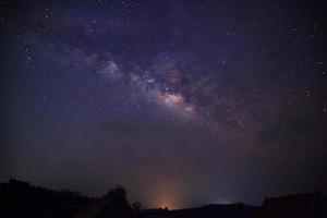 Silhouette of Tree with cloud and Milky Way. Long exposure photograph.With grain photo