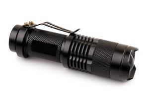 black metallic flashlight isolate on white background photo