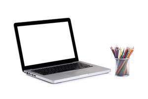 laptop blank screen with colorful pencils photo