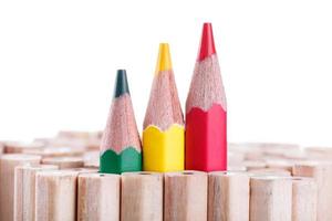 three sharpened green,yellow,red pencil among many ones photo
